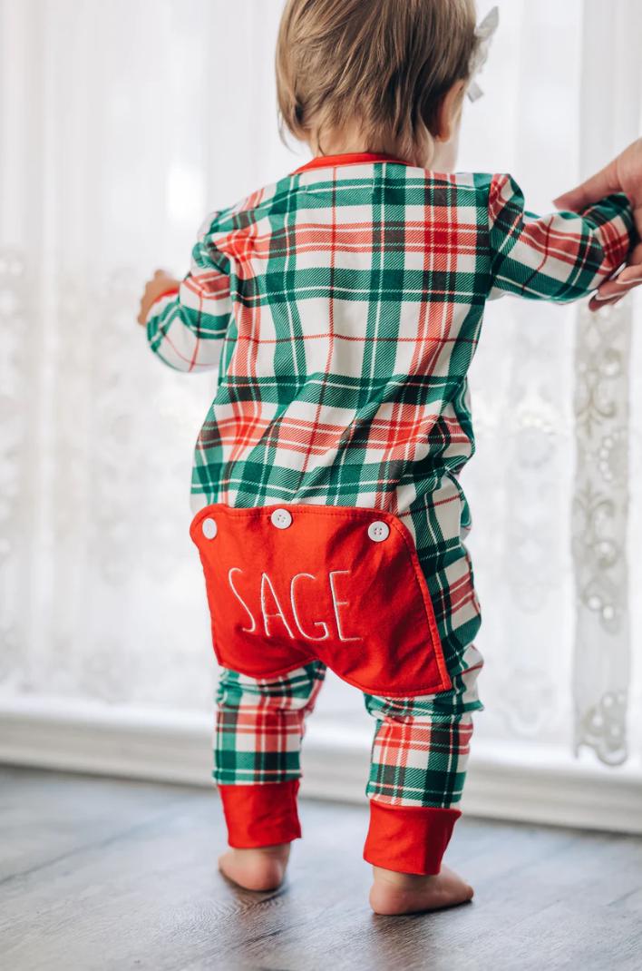 Kids in personalized Christmas pajamas